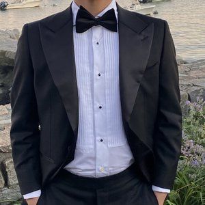 Tuxedo jacket, trousers, and shirt (with black studs)